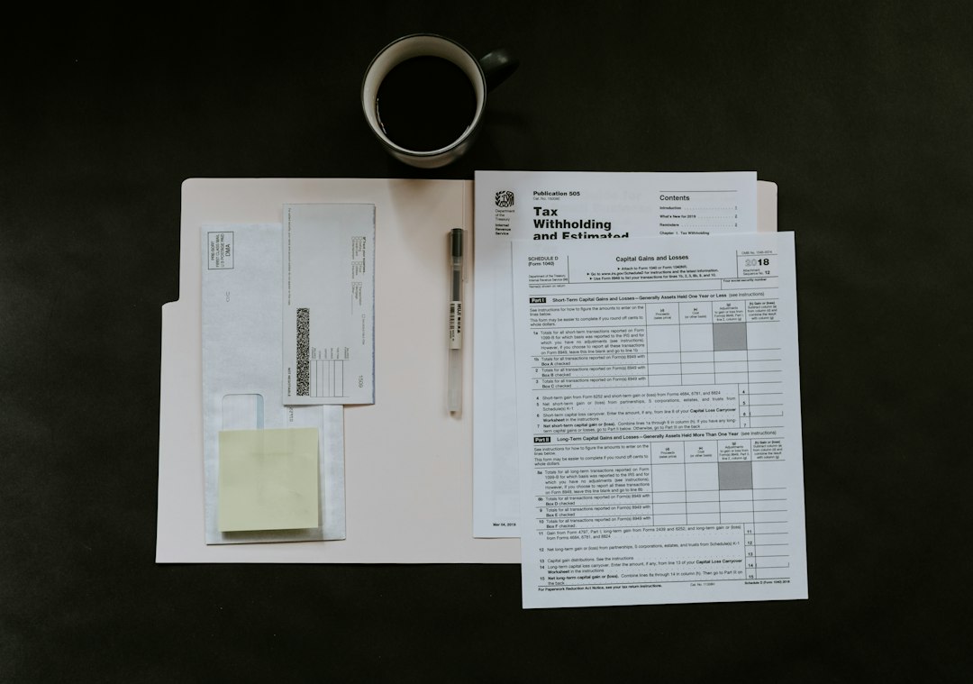 A desk with printed forms, a pen, and a coffee mug during a vendor review session