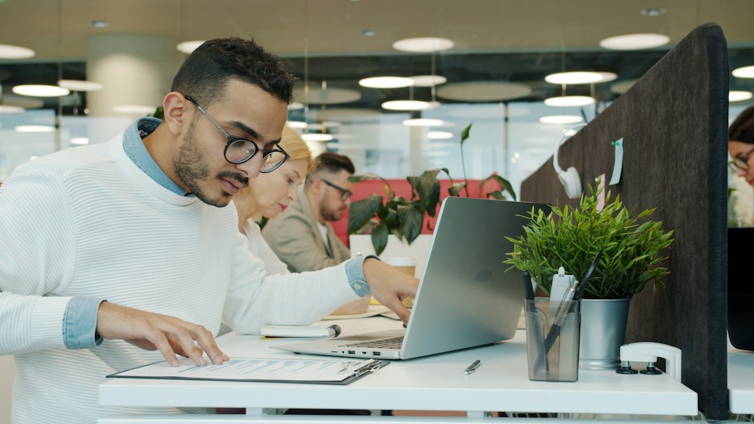 Professionals working together in a shared office workspace